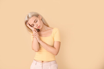 Exhausted woman on color background. Diabetes symptoms