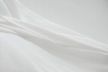Fototapeta na wymiar Flowing white curtain motion textured background