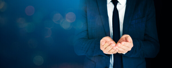 Businessman cupped his hands in blue tone