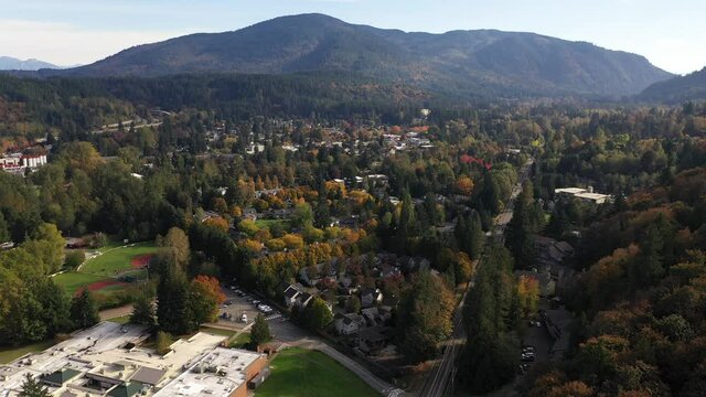 Aerial / drone footage of Issaquah, Olde Town, Sycamore, Squak Mountain, Tiger Mountain, Park Pointe, Poo Poo Point, commercial area and surrounding suburbs in King County, Washington