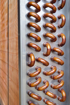 Vertical Shot Of Copper Plain Tubes Of A Condenser Coil.