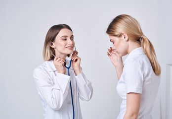The patient complains to the doctor at will and a blue stethoscope