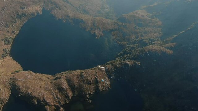 4k aerial drone footage over the first two lagoons (lakes) of Pichgacocha from Ambo, Huanuco, Peru in the Andes mountains. Dolly in wide angle shot.