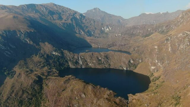 4k aerial drone footage over the first two lagoons (lakes) of Pichgacocha from Ambo, Huanuco, Peru in the Andes mountains. Boom/jib down wide angle shot.