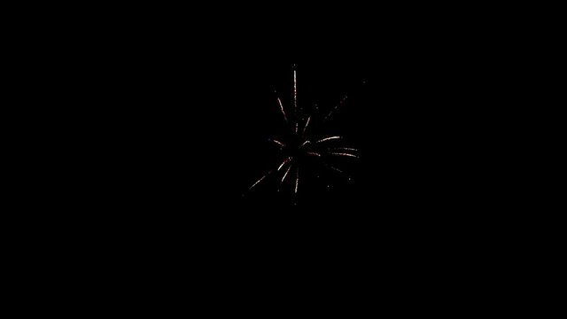 Element of multicolored firework on black background to create a set of salutes through mounting. Slow Motion shot.