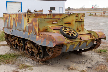 Vintage and rusted World War Two era armoured car sits neglected in southern Alberta.