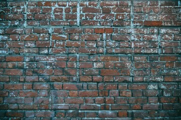 Background and texture old shabby red brick stone wall.
