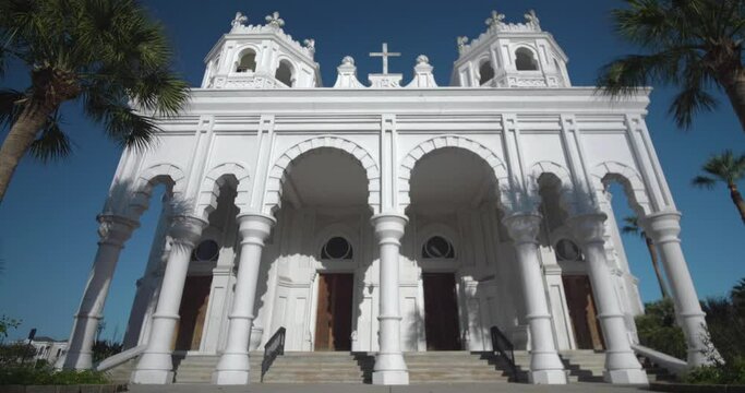 Low angle view of the Historic Sacred Heart Catholic Church on Galveston Island, Texas. This video was filmed in 4k for best image quality.