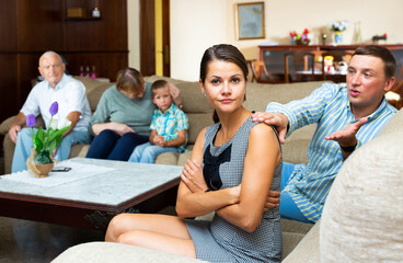 Quarrel between husband and wife in a large family. High quality photo