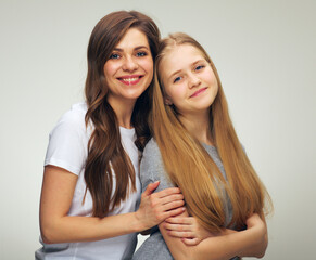 young woman and smiling teenager