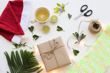 gift box for special in christmas and new year festival day with scarf knitting wool of lifestyle woman in winter season and hot honey lemon healthy drinks for health care on background white