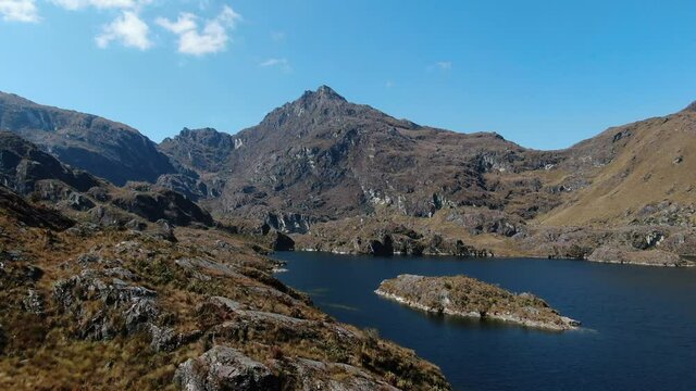 4k aerial drone footage over the 4th lagoon of Pichgacocha from Ambo, Huanuco, Peru in the Andes mountains. Dolly in and flying low wide angle shot.