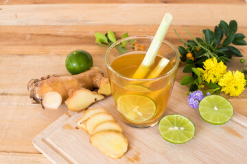 herbal healthy drinks mix ginger ,lemon ,honey ,lemongrass for sore throat on background wooden