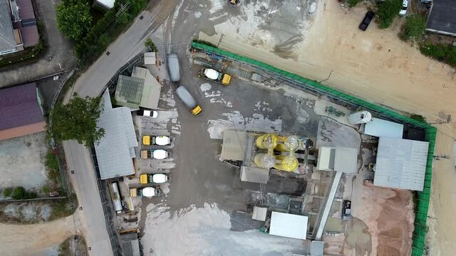 Overhead static shot of aggregate truck delivering to Asian concrete plant