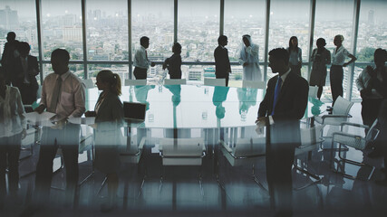 Business people in a board room meeting - Powered by Adobe