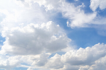 Blue sky with white clouds pattern background. Sky and clouds in daylight. Outdoor natural background.
