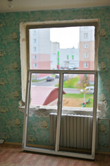 Photo of pvc window installation in a city apartment.