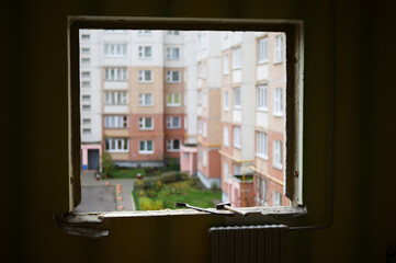 Photo of dismantling a window in a city apartment. An empty opening in the wall