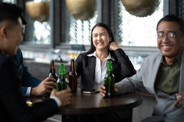Group Of Asian Friends Enjoying Evening Drinks in bar. Celebration, Party People Christmas and Happy new year concept. Asian business people in party.