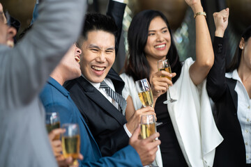 Group Of Asian Friends Enjoying Evening Drinks in bar. Celebration, Party People Christmas and Happy new year concept. Asian business people in party.