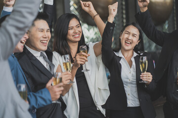 Group Of Asian Friends Enjoying Evening Drinks in bar. Celebration, Party People Christmas and Happy new year concept. Asian business people in party.