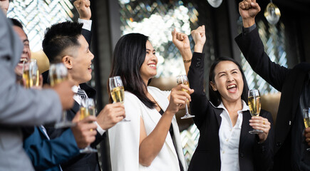 Group Of Asian Friends Enjoying Evening Drinks in bar. Celebration, Party People Christmas and Happy new year concept. Asian business people in party.