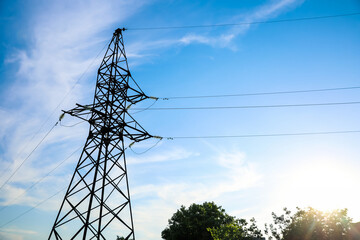 High voltage tower against beautiful blue sky