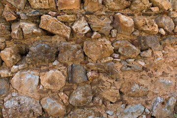 Antique stone wall. Old gray bricks background.