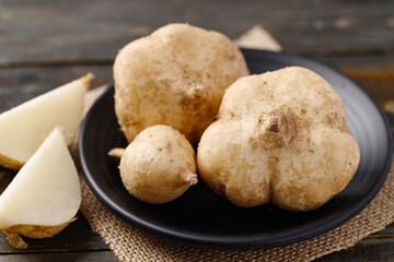 Fresh jicama or yam bean, Jicama can be eaten raw or cooked, The taste are crisp, juicy, moist, and slightly sweet