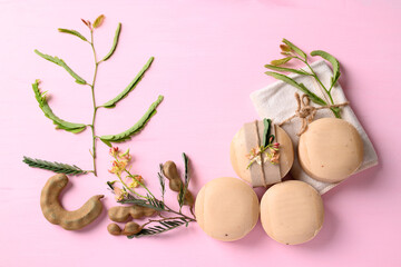 Tamarind soap on pink background, organic natural product for skin care
