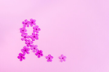 Pink flowers making ribbon shape for breast cancer awareness.
