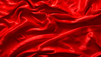 Red silk or satin luxury fabric texture can use as abstract background. Top view.