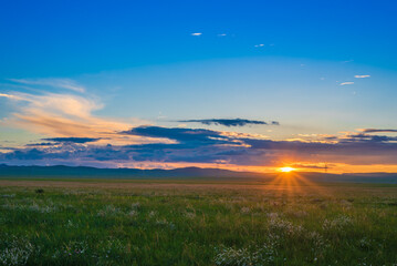 Fototapeta na wymiar Sunset scenery on the prairie.