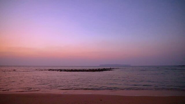 Sunrise on the Sitapur beach in Neil island, Andaman and Nicobar islands, India. With the small Rose island in the distance. 