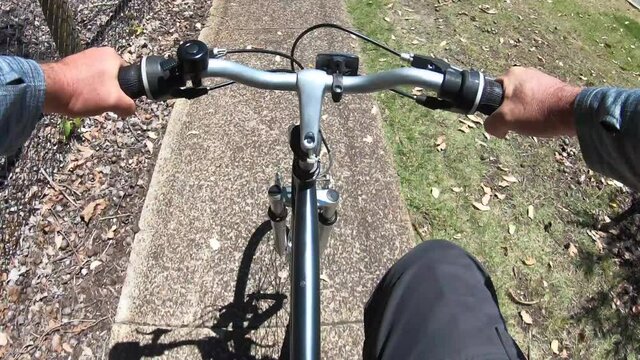 POV (personal perspective) hyper lapse person riding a bicycle on a bike path