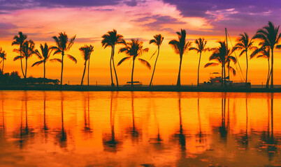 Naklejka na ściany i meble Paradise beach travel destination on Caribbean island, summer vacation dream background of palm trees silhouette reflection on calm water sea panorama.