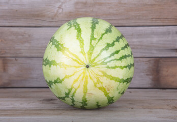 A fresh green watermelon in the hot summer