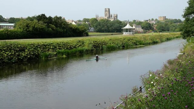 Rower in the River Wear against the Durham skyline, in 4K