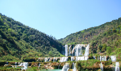 Fototapeta na wymiar Waterfall scenery photography in the mountains