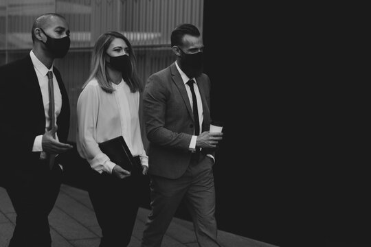 Business People In Medical Masks Walking To The Office