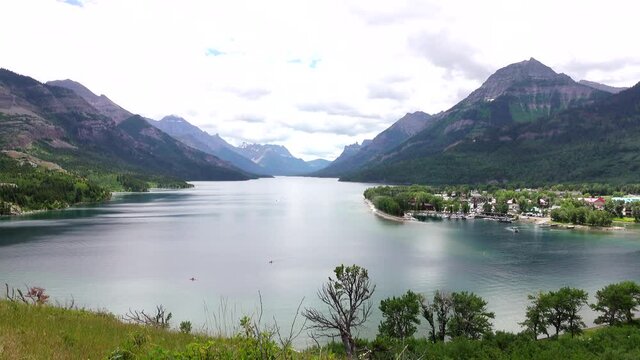 Beautiful Lake Waterton, with a view of the town of Waterton. The world's first International Peace Park shared by Canada and the United States of America. In the distance is Glacier National Park.