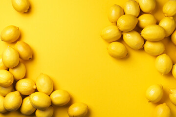 Lemons frame on yellow background. Immune system booster. Copy space. Top view. Flat lay. Citrus fruits. Vitamins for health. Liposomal vitamin C. Lemon for vegan, vegetarian alkaline diet