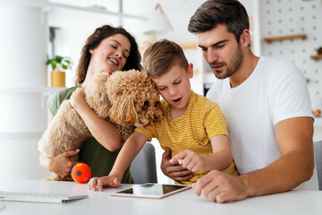 Parents helping to children studying online at home. Lockdown and online school, technology concept.