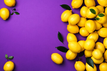 Lemons frame on violet background. Immune system booster. Copy space. Top view. Flat lay. Citrus fruits. Vitamins for health. Liposomal vitamin C. Lemon for vegan, vegetarian alkaline diet