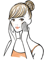 頬を触りスキンケアをしてこちらを向く女性