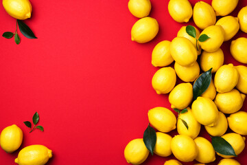 Lemons frame on red background. Immune system booster. Copy space. Top view. Flat lay. Citrus fruits. Vitamins for health. Liposomal vitamin C. Lemon for vegan, vegetarian alkaline diet