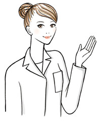 お団子ヘアの白衣を着て案内する女性