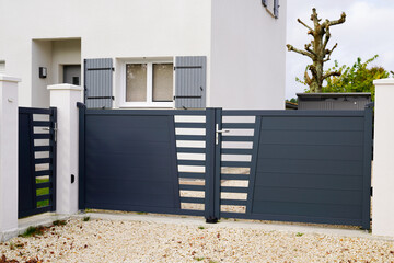 modern dark gray gate aluminum portal and door outdoor of suburbs house