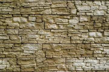 Stone pebbles old wall vintage texture background brick siding different sized stones