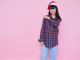 Teenage girl wearing Santa Claus hat